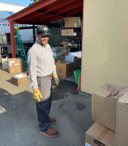 A happy smiling plumber at his Sonoma plumbing headquarters.