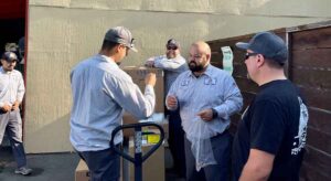 The best plumbers in Sonoma Valley gathering around boxes.